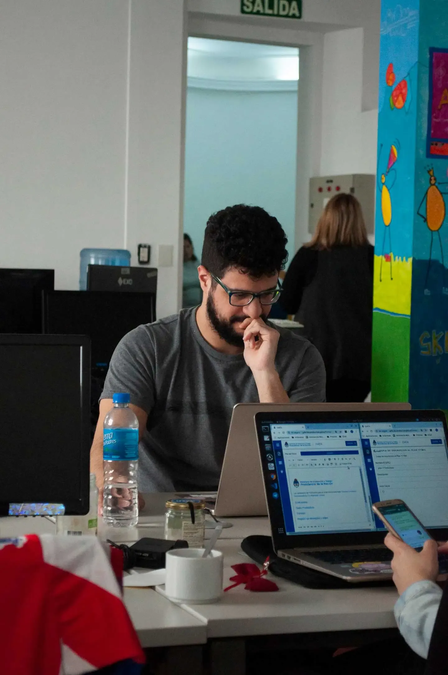 Code 83 team member working on a laptop
